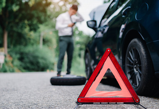 car service customer receiving keys from technician at auto shop 12 new keys handed over